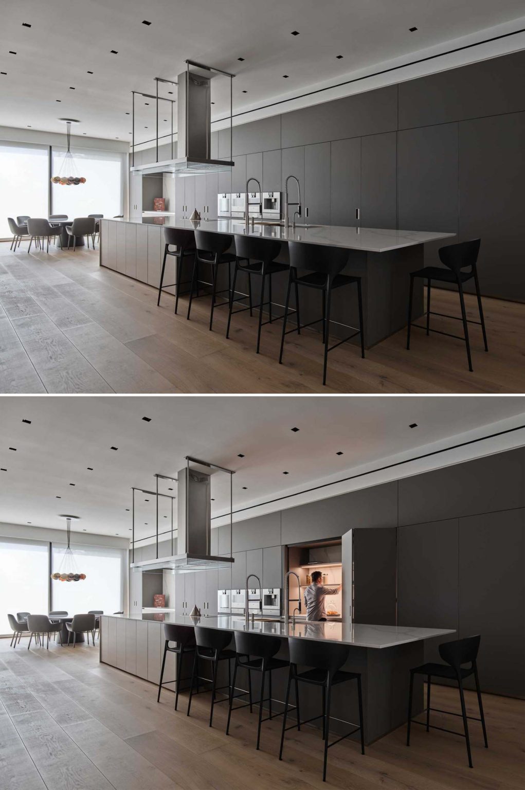Grey cabinetry stretches along the kitchen and dining wall of Nanton House, contrasting with warm wood floors and millwork, while an island provides bar seating and garden views.