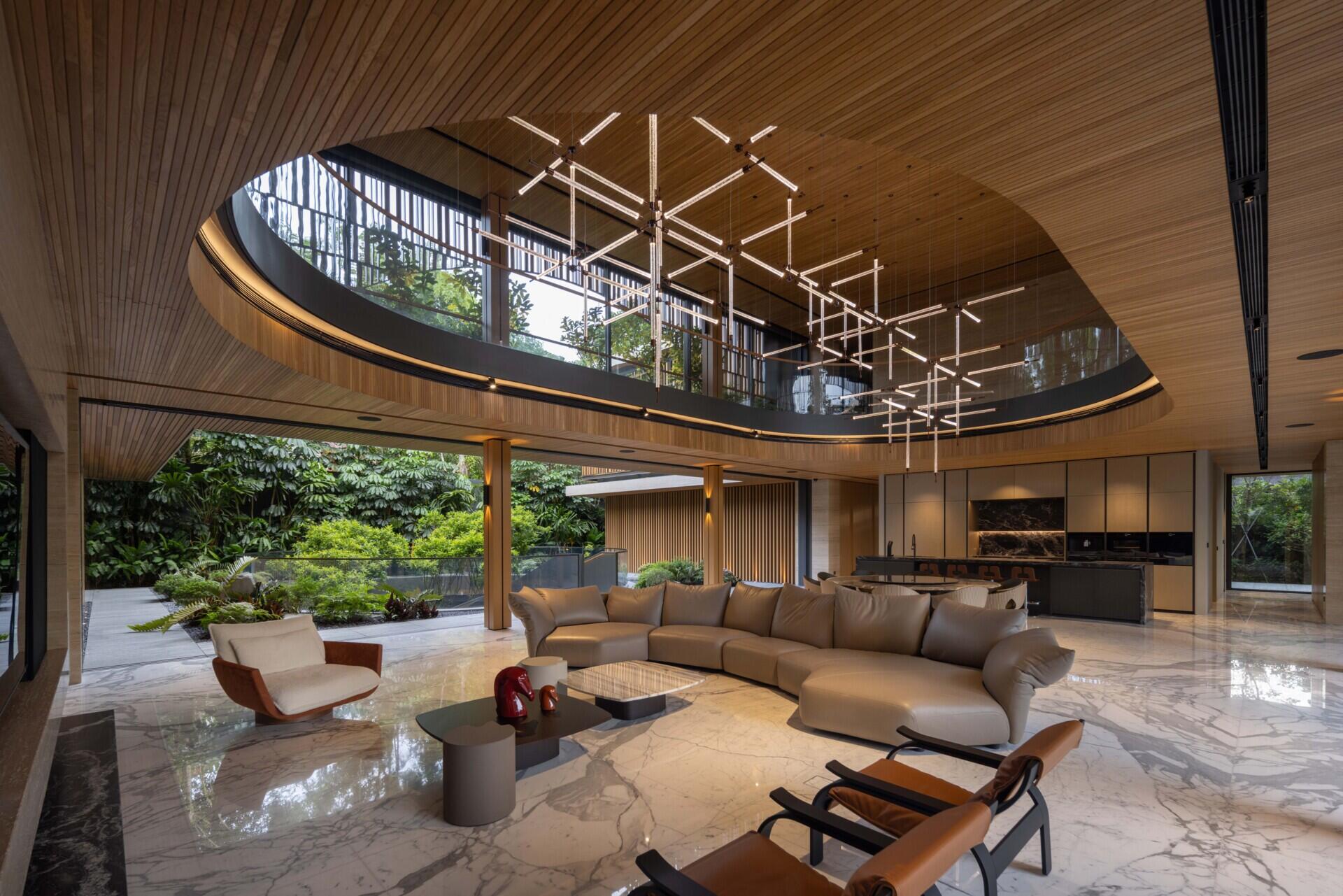 Living and dining spaces surround lush water gardens, creating views of planting throughout the lower levels.