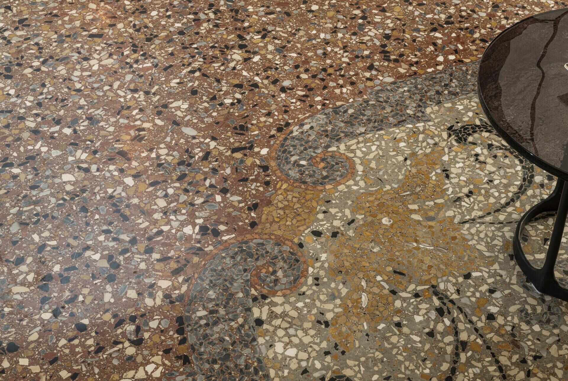Original Venetian terrazzo flooring adds character and colour to this historic Italian apartment, inspiring a warm palette of ochre, cream, chocolate and red.