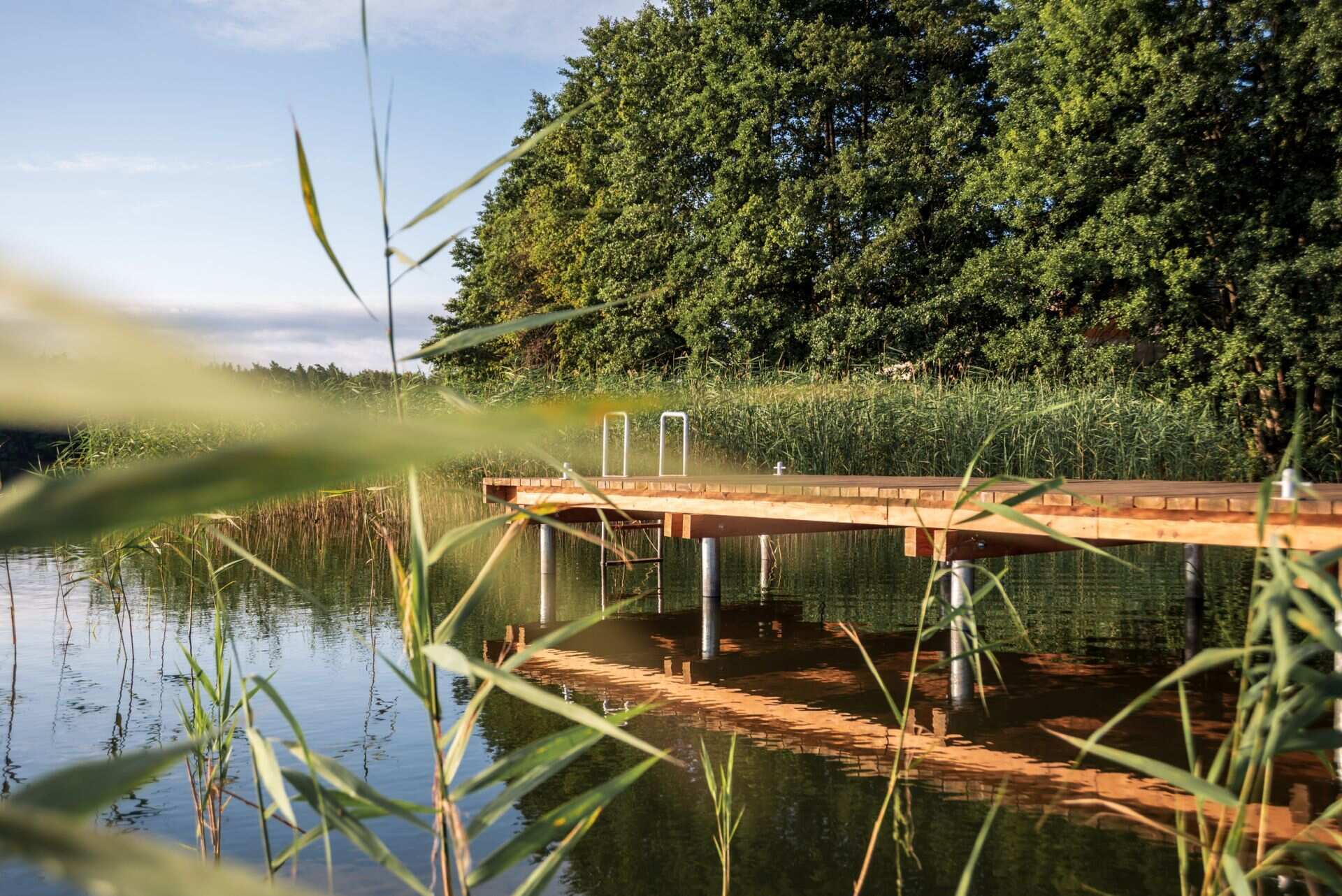 Explore the year-round appeal of Kalbornia Mazury, from swimming in the lake during summer to forest walks and evenings beside the fireplace in winter.
