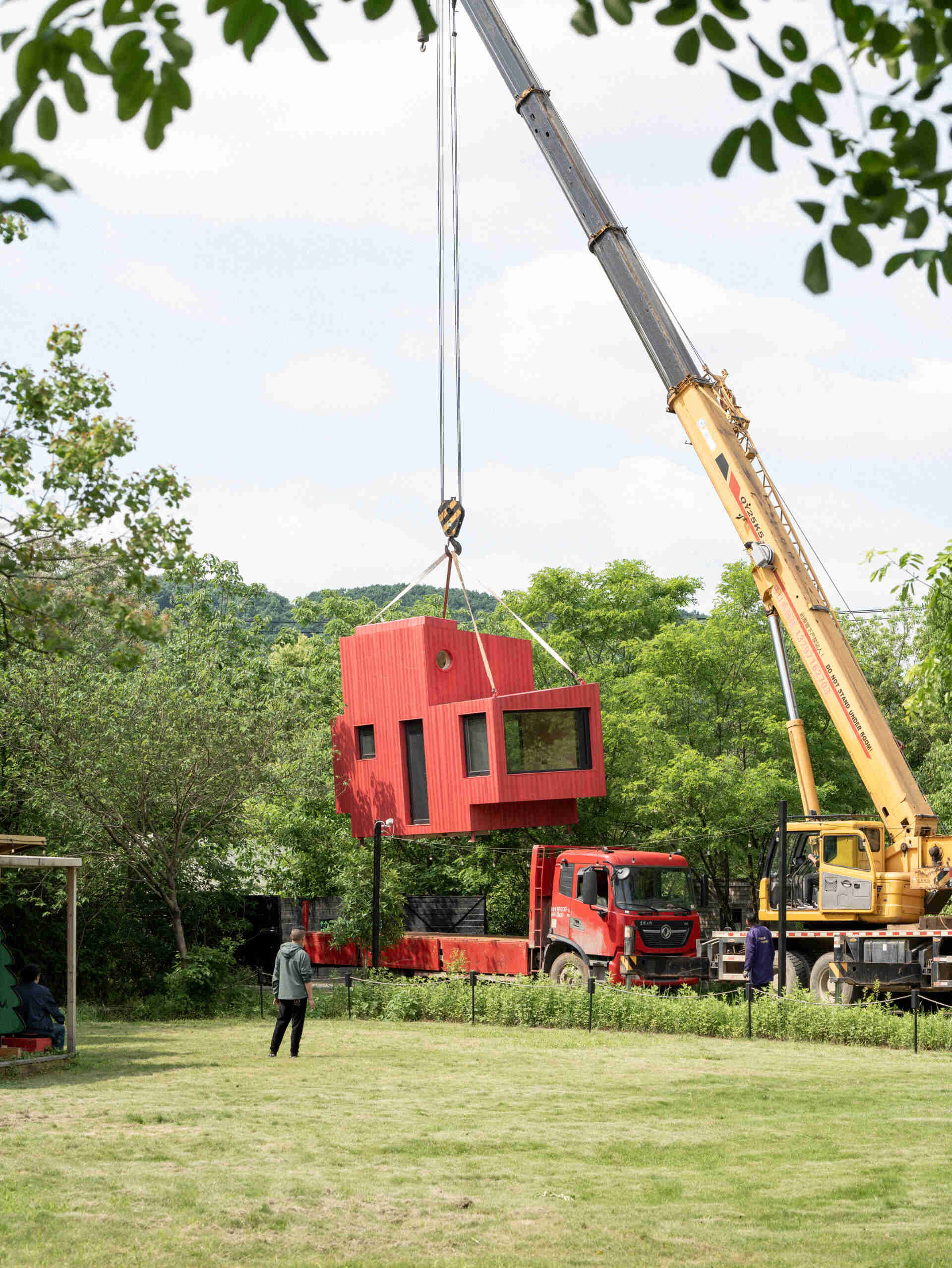 Wiki World’s modular forest cabins are elevated above the ground and assembled from prefabricated timber components, creating a Lego-like approach to woodland architecture.
