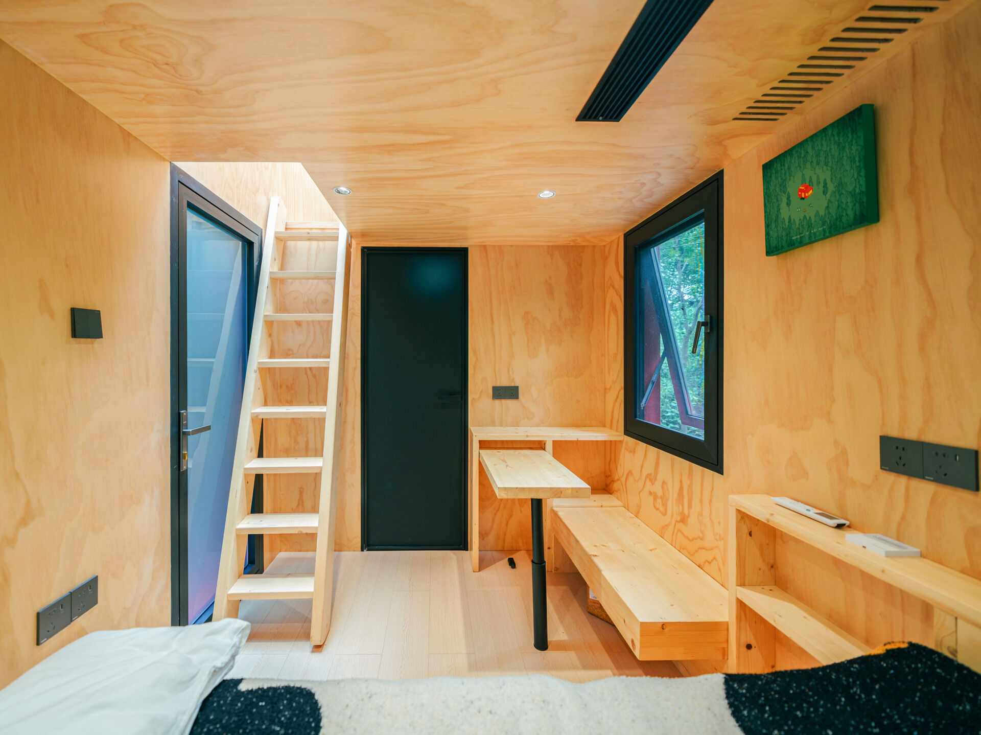 Step inside Wiki World’s Red Submarine Cabin, where circular portholes, panoramic windows and forest views create the feeling of sailing through the trees.