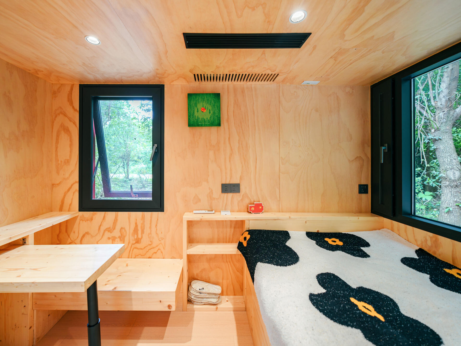 Step inside Wiki World’s Red Submarine Cabin, where circular portholes, panoramic windows and forest views create the feeling of sailing through the trees.