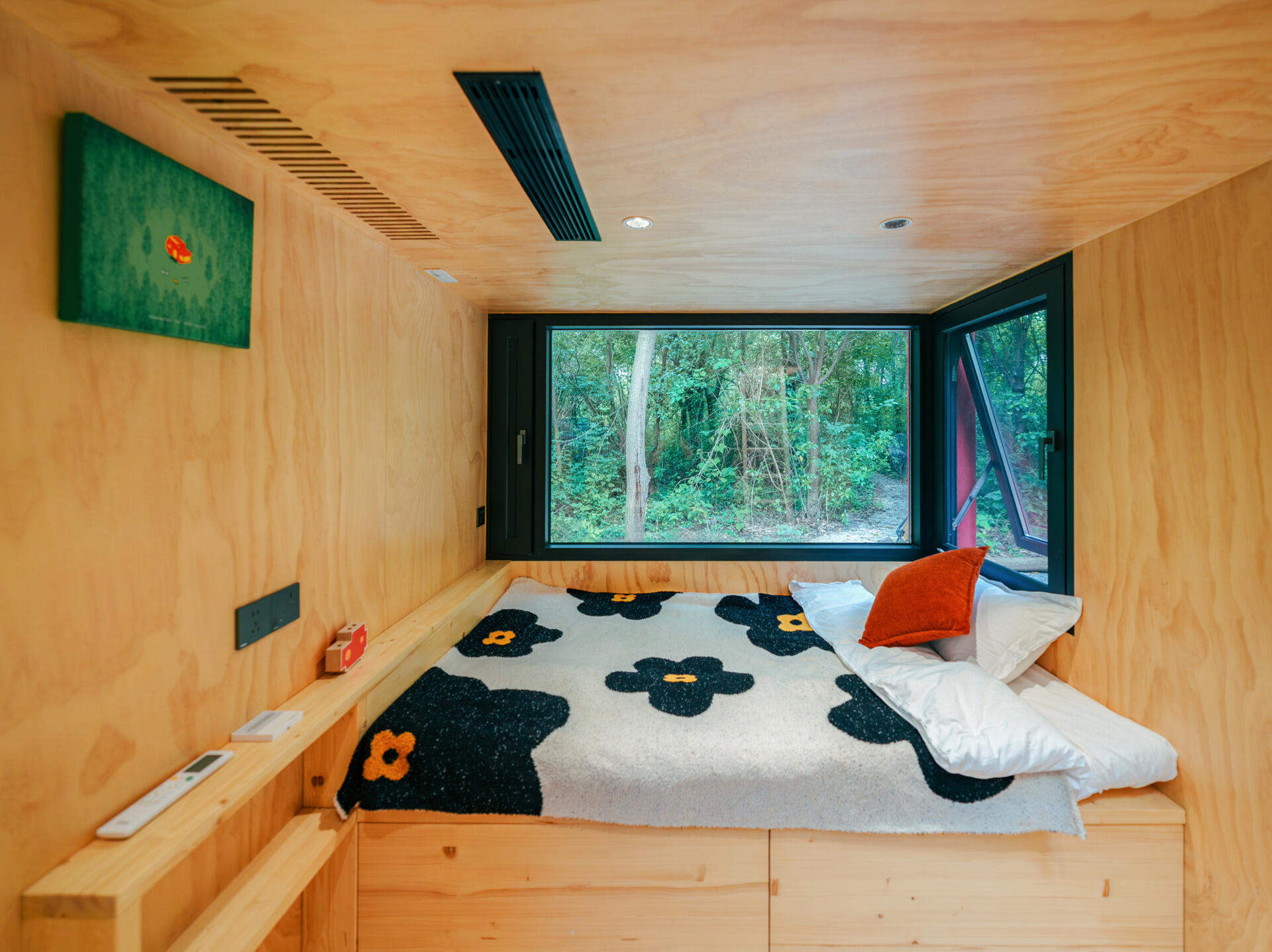 Step inside Wiki World’s Red Submarine Cabin, where circular portholes, panoramic windows and forest views create the feeling of sailing through the trees.