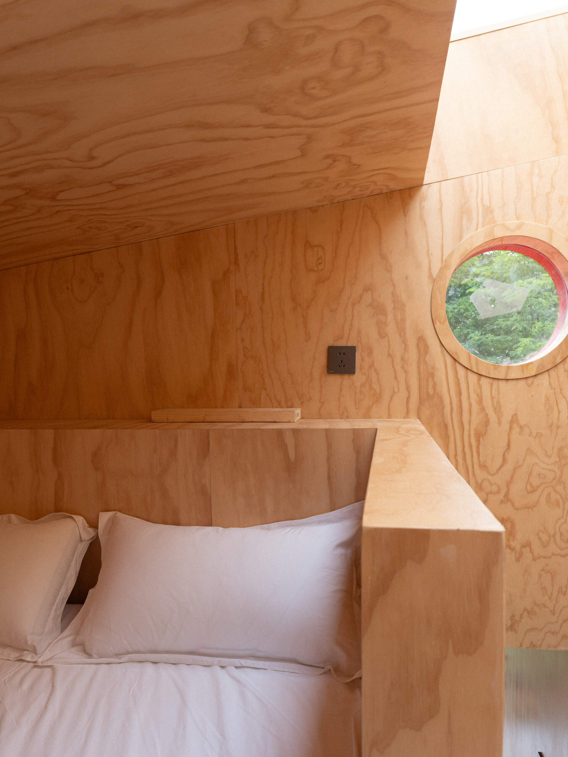 Step inside Wiki World’s Red Submarine Cabin, where circular portholes, panoramic windows and forest views create the feeling of sailing through the trees.