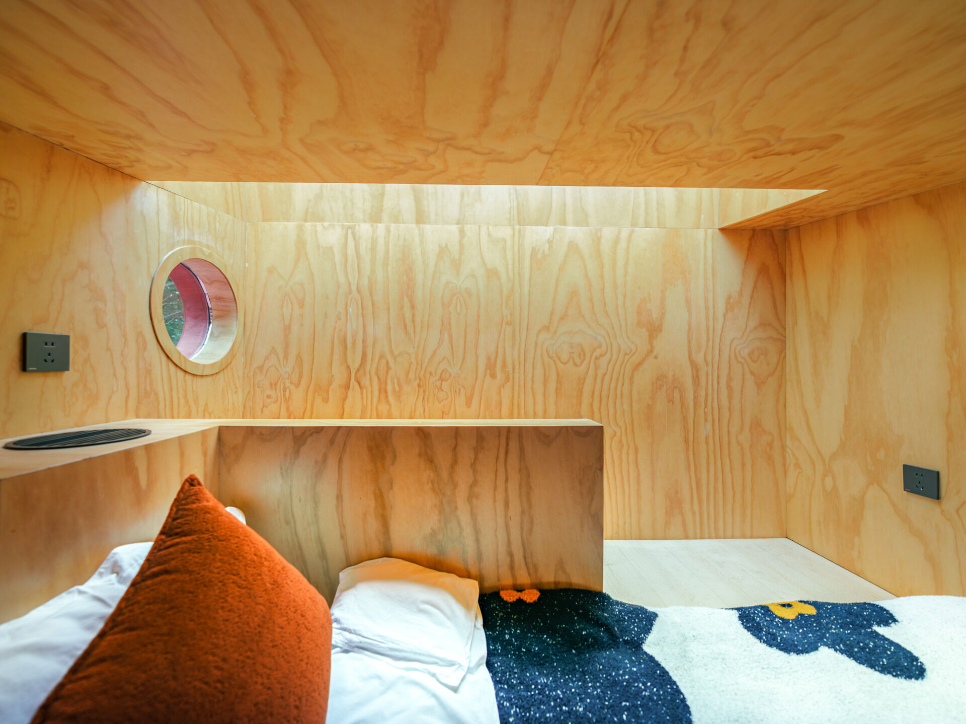 Step inside Wiki World’s Red Submarine Cabin, where circular portholes, panoramic windows and forest views create the feeling of sailing through the trees.