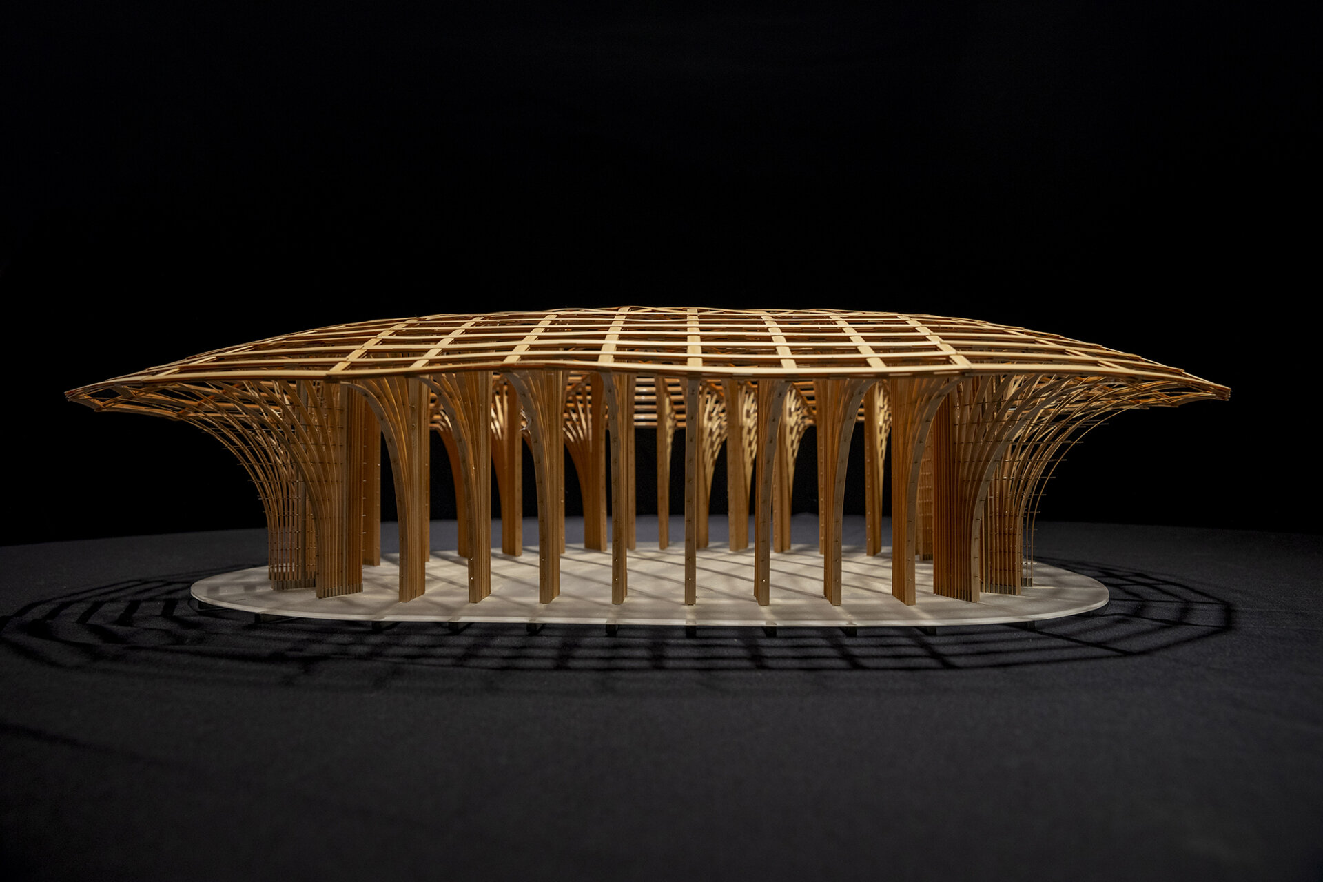 West Garden Florist by LUO studio is a mushroom-like timber florist pavilion tucked among the trees of Haidian Park in Beijing, with a planted roof and open canopy.