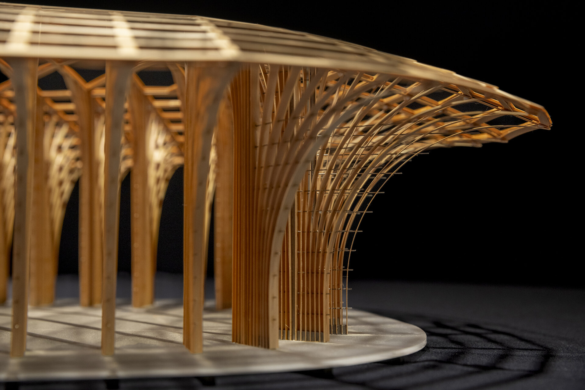 West Garden Florist by LUO studio is a mushroom-like timber florist pavilion tucked among the trees of Haidian Park in Beijing, with a planted roof and open canopy.