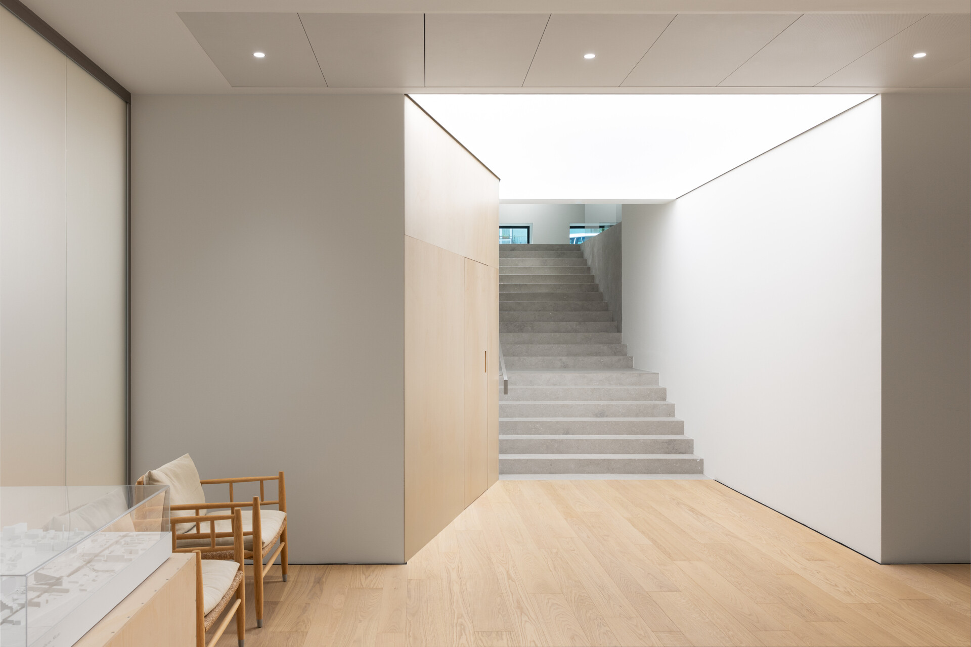 Explore RG27, ACPV ARCHITECTS' new Milan headquarters, featuring contemporary office interiors, open-plan workspaces, a central garden courtyard, architectural model archives, and a materials library.