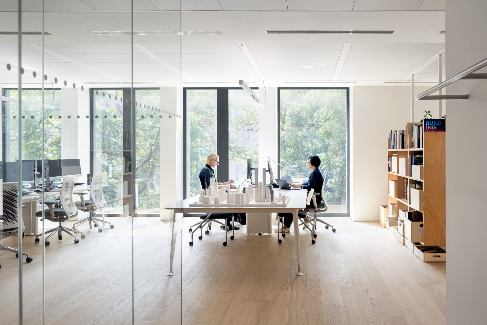 Explore RG27, ACPV ARCHITECTS' new Milan headquarters, featuring contemporary office interiors, open-plan workspaces, a central garden courtyard, architectural model archives, and a materials library.
