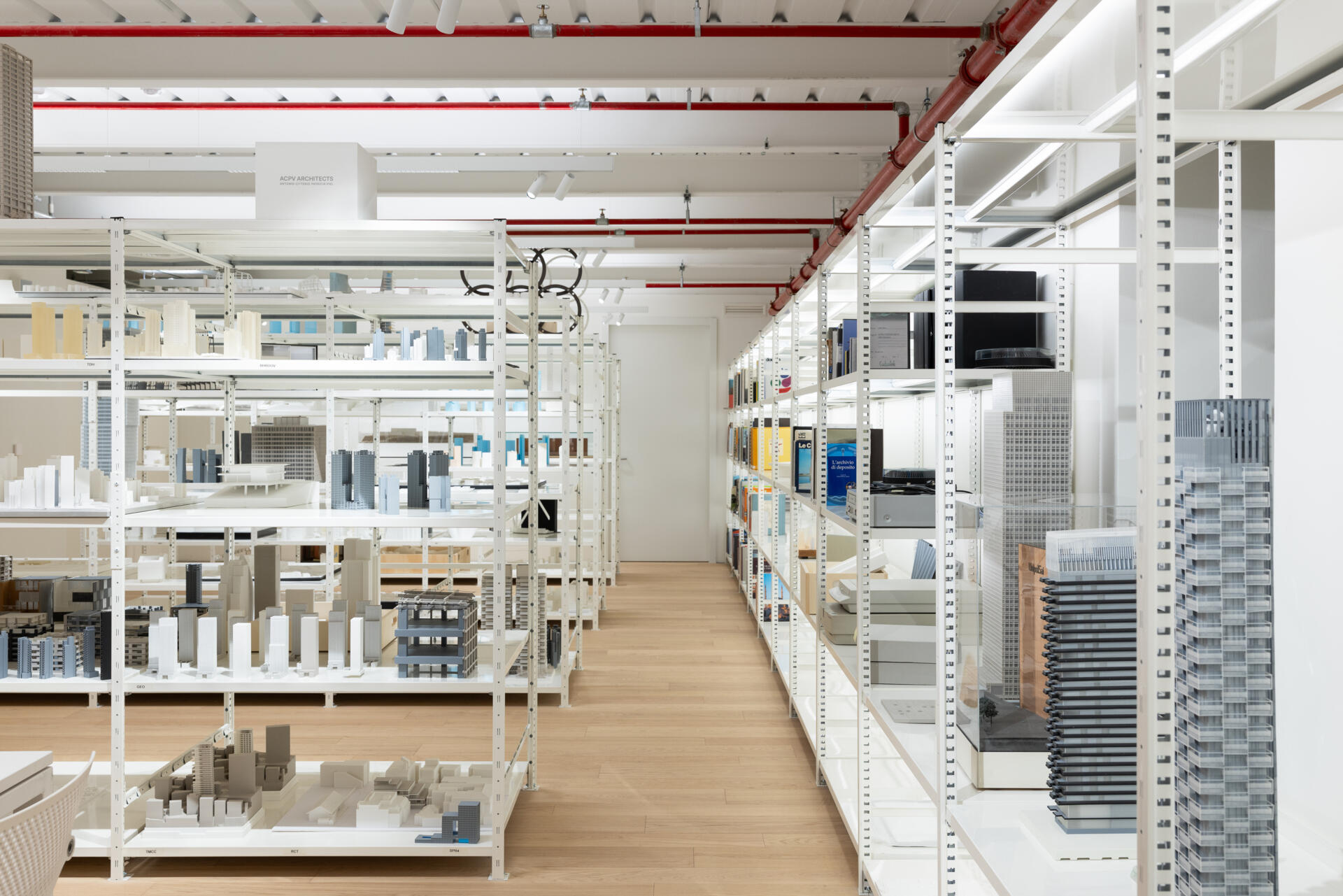 Explore RG27, ACPV ARCHITECTS' new Milan headquarters, featuring contemporary office interiors, open-plan workspaces, a central garden courtyard, architectural model archives, and a materials library.