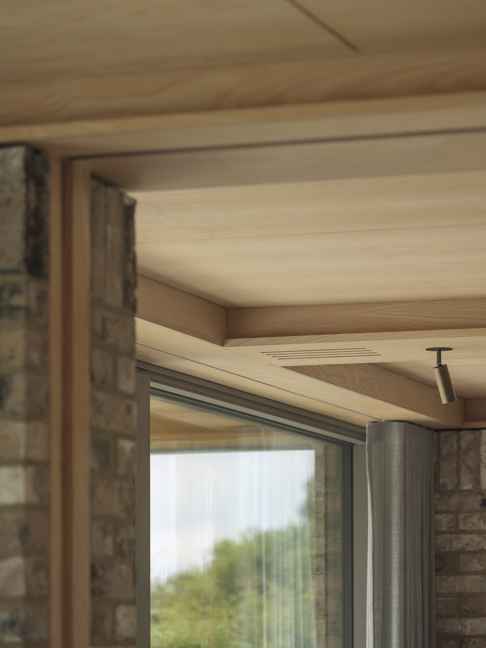 Explore the textured brickwork of this modern Suffolk house, where different brick patterns reference the history of traditional English longhouses.