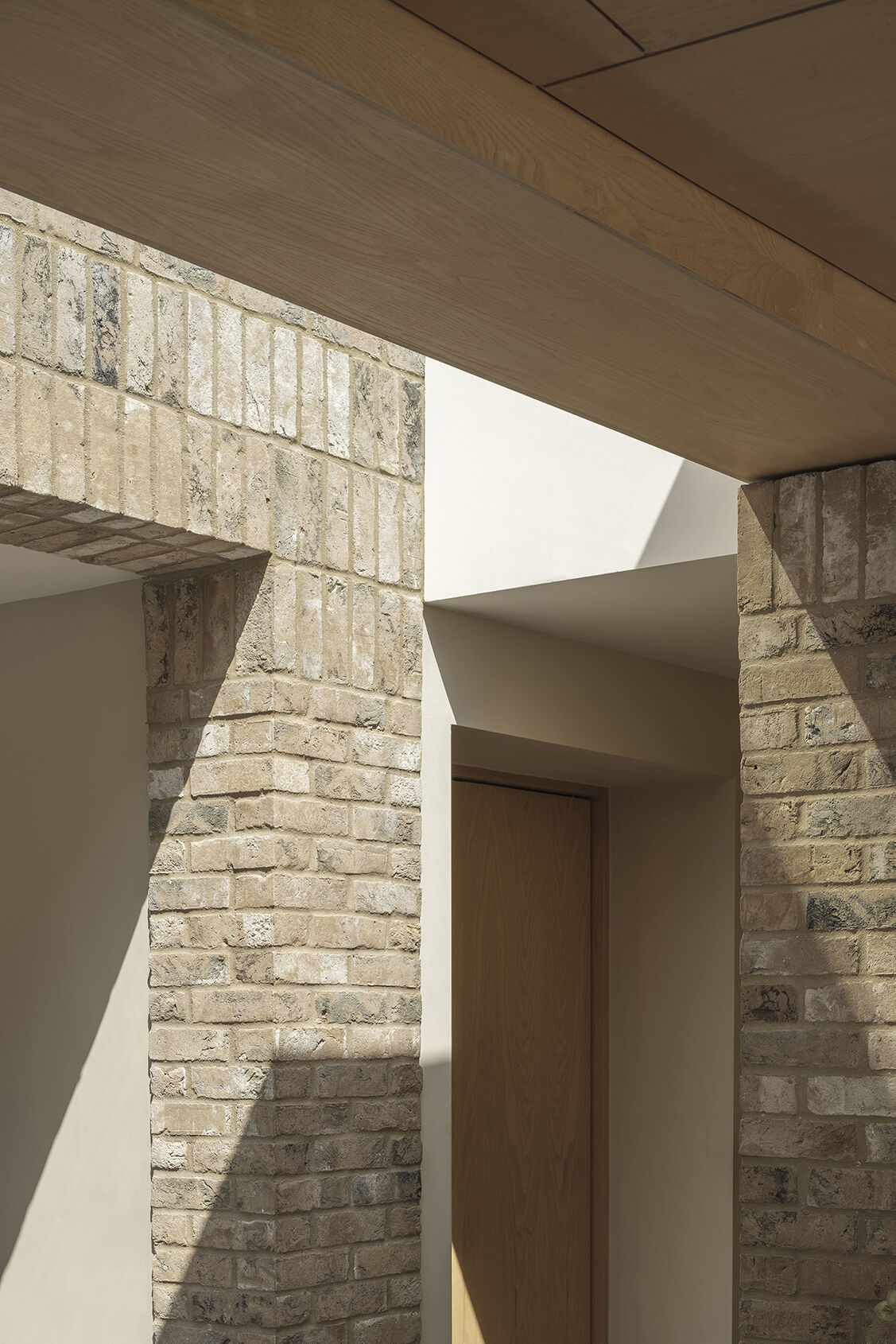 Explore the textured brickwork of this modern Suffolk house, where different brick patterns reference the history of traditional English longhouses.