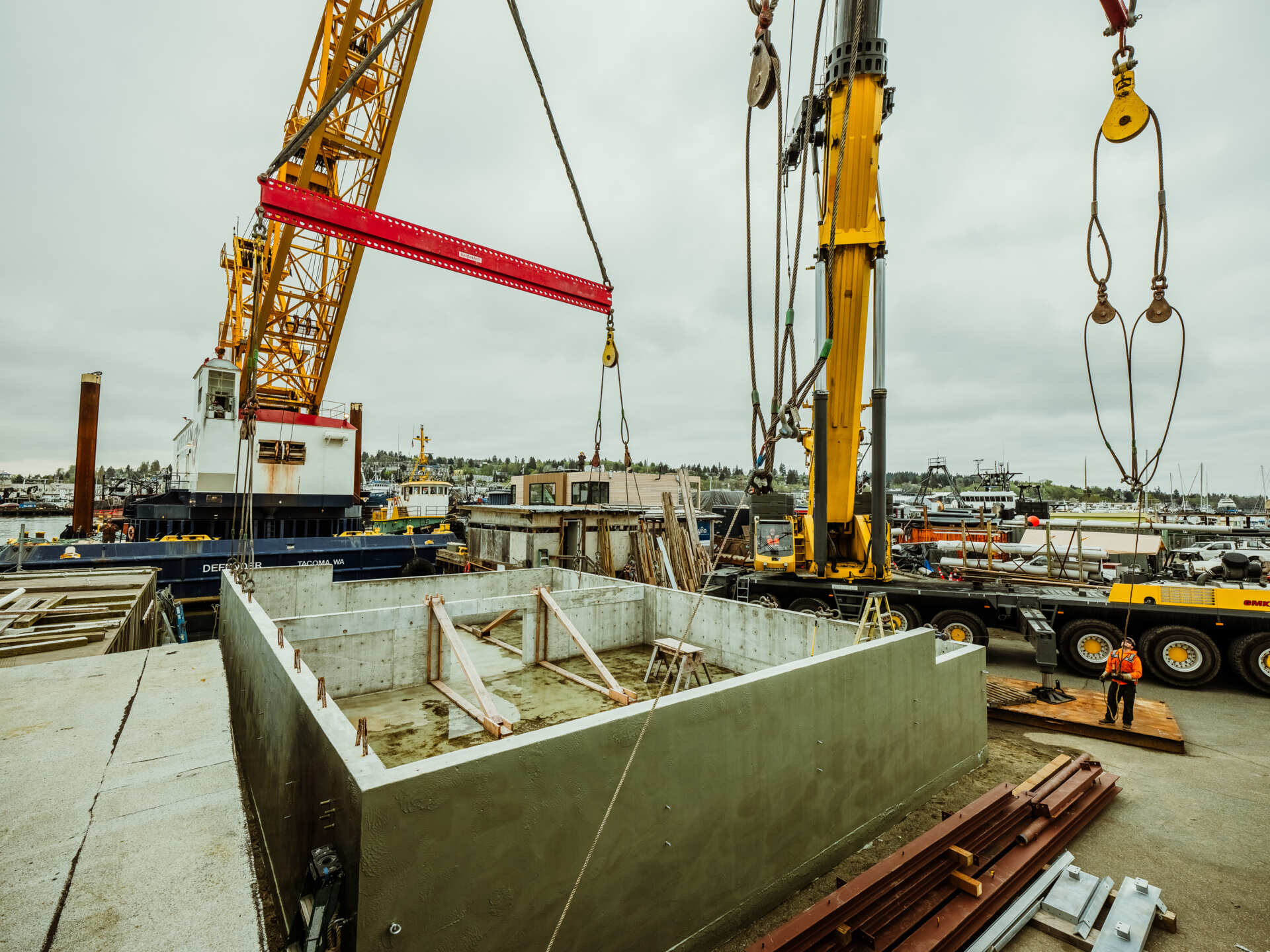 A behind-the-scenes look at the construction of Modern Beach House, a contemporary floating home on Seattle's Lake Union. Designed by Hoshide Wanzer Architects + Interiors and built by Dyna Builders at their Ballard docks, the two-story home was constructed on a new concrete float before being moved to its permanent waterfront location.