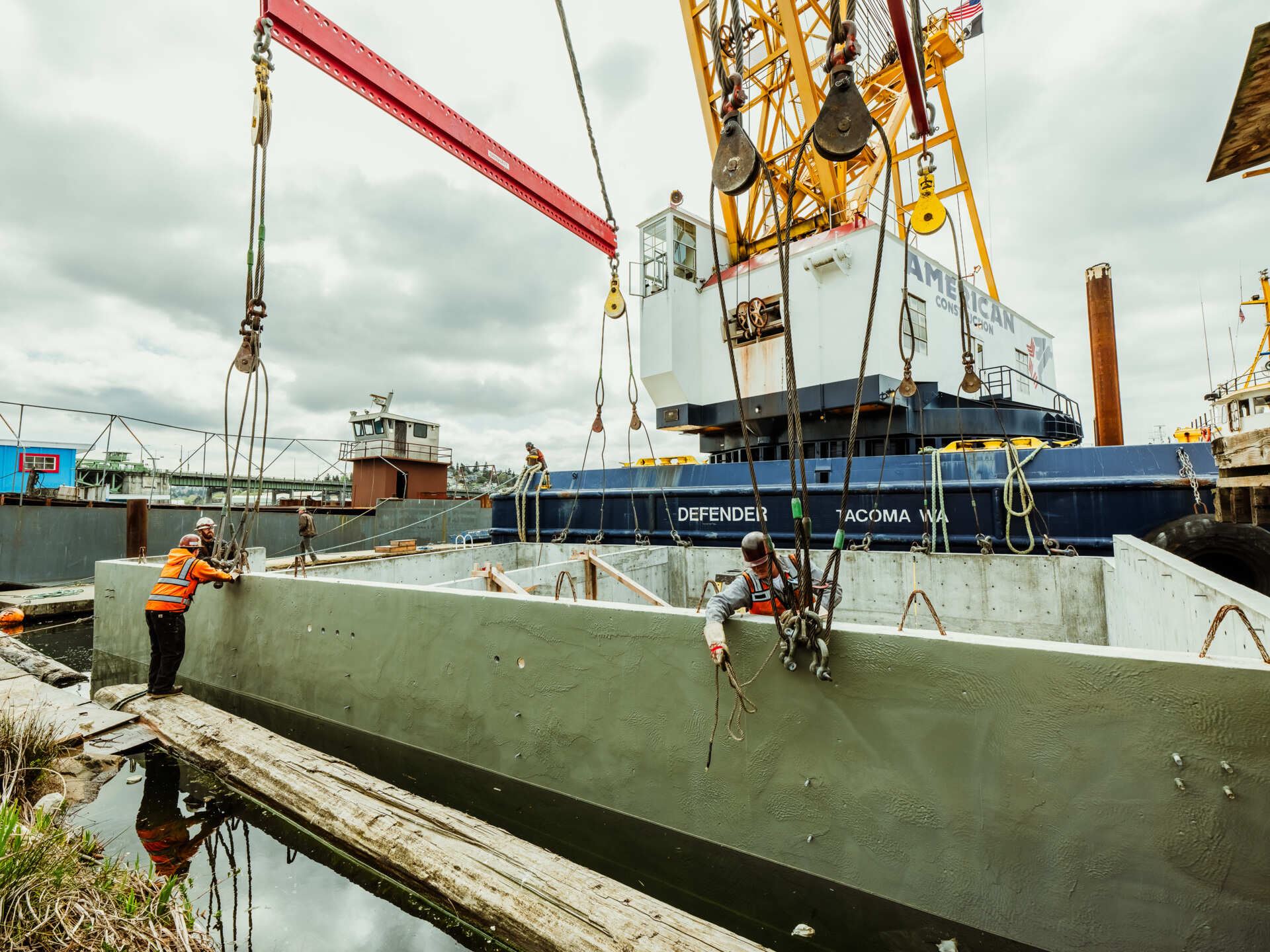 A behind-the-scenes look at the construction of Modern Beach House, a contemporary floating home on Seattle's Lake Union. Designed by Hoshide Wanzer Architects + Interiors and built by Dyna Builders at their Ballard docks, the two-story home was constructed on a new concrete float before being moved to its permanent waterfront location.