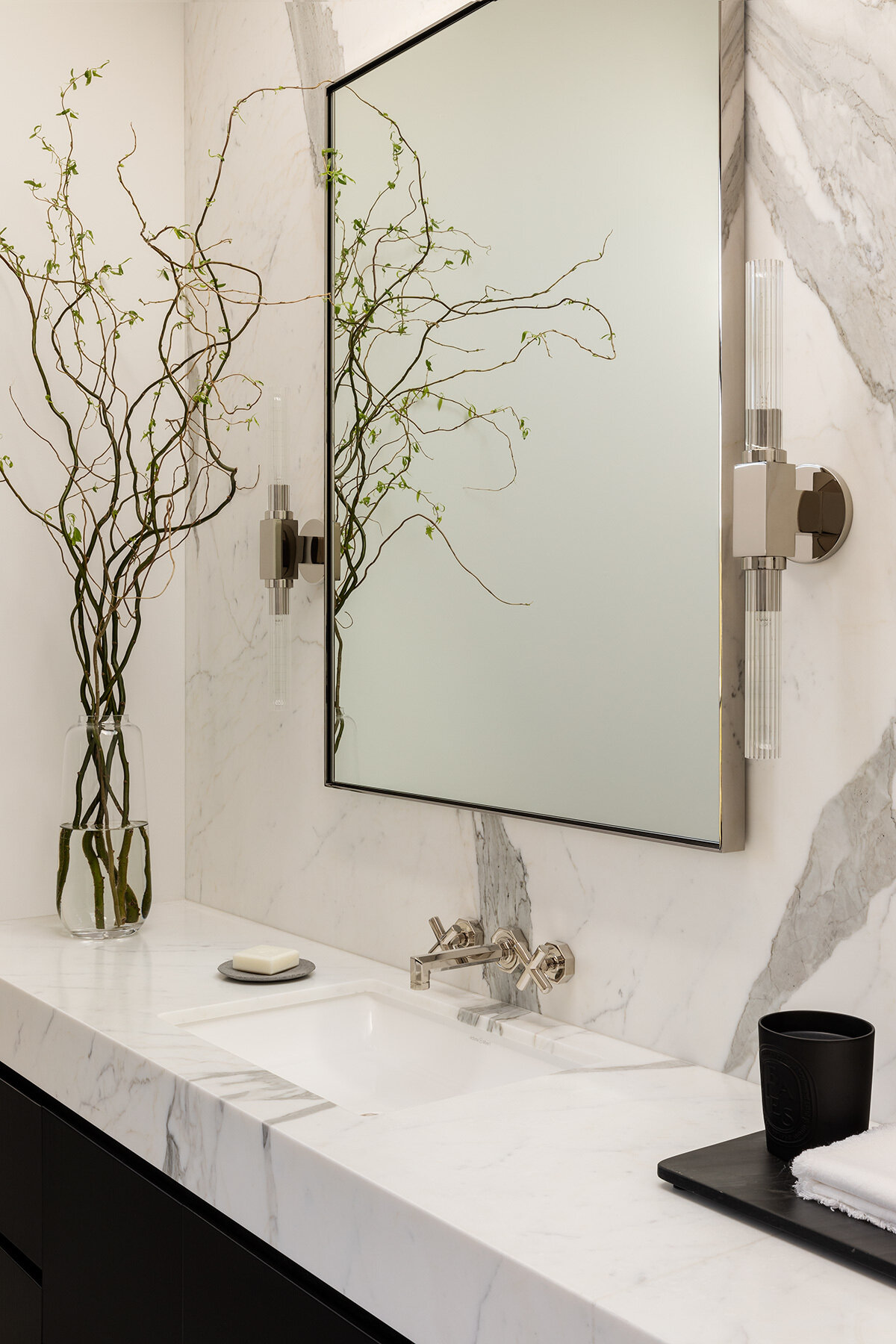 Explore the Atherton Residence bathroom by Paulina Carcach Studio, featuring a freestanding tub, walk-in shower, skylight, grey-veined marble walls and a long matte black double vanity.