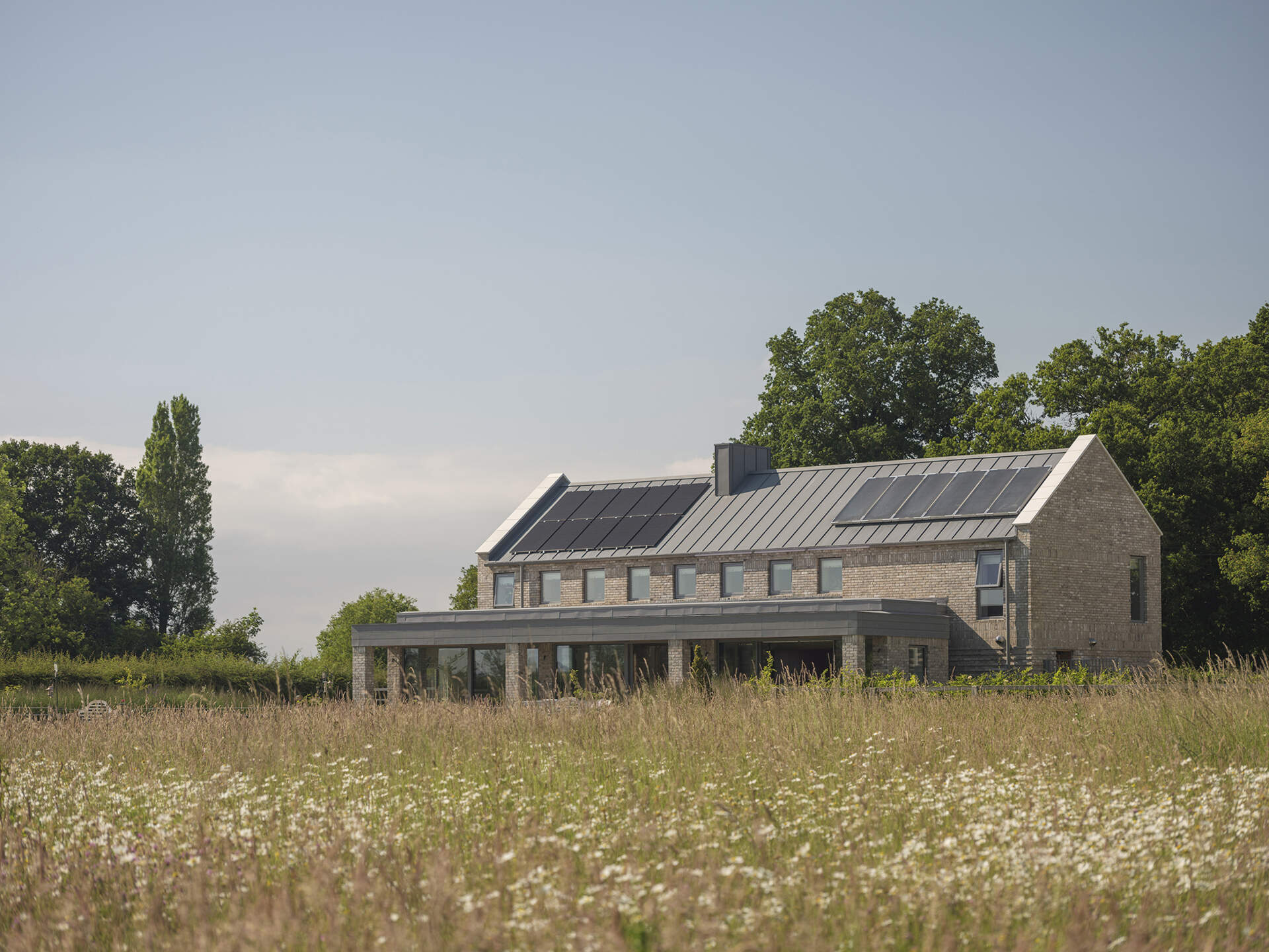 Discover a modern English house designed using Passivhaus principles, including insulated prefabricated construction, heat-recovery ventilation, and solar-assisted heating.