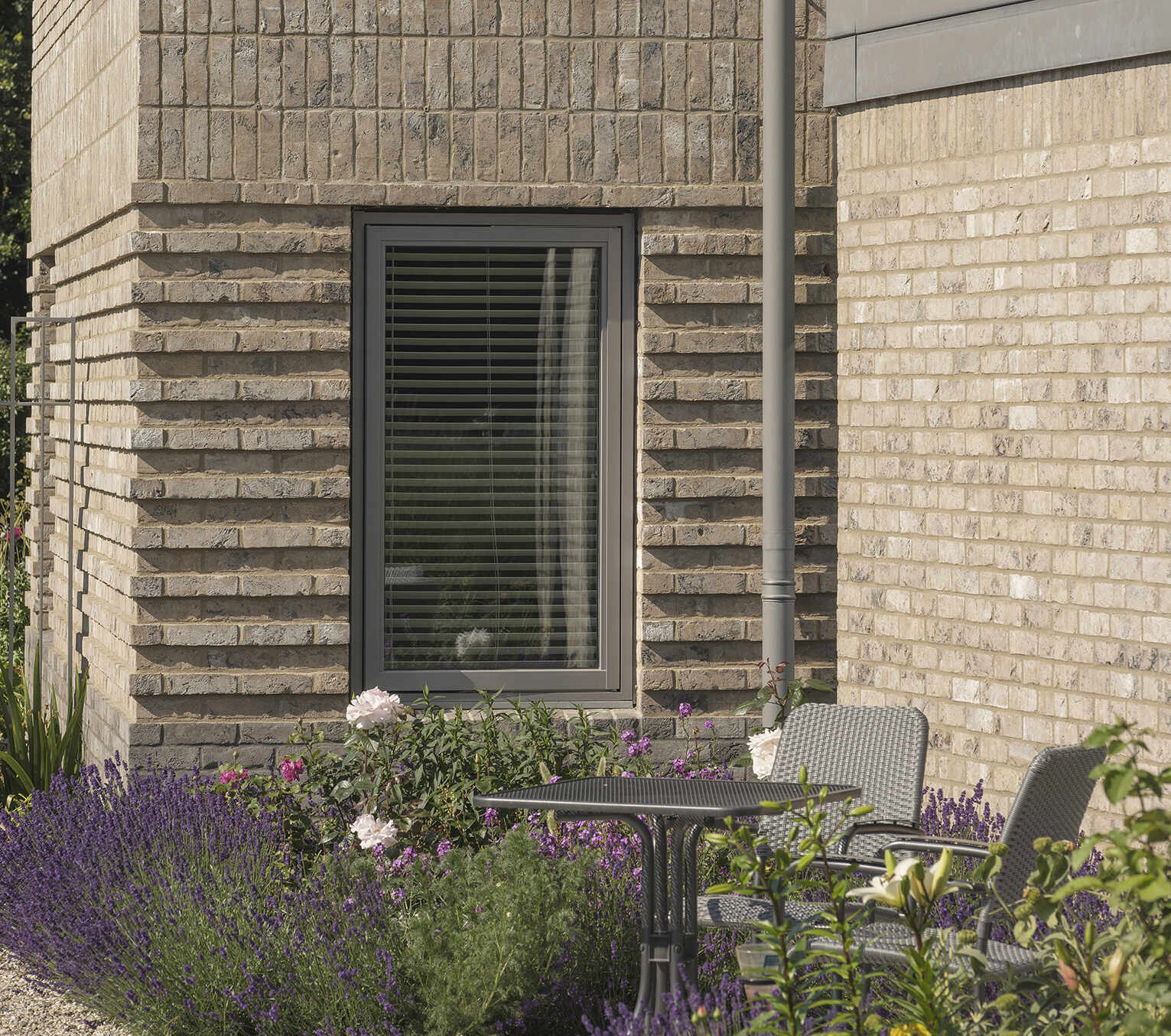 Explore the textured brickwork of this modern Suffolk house, where different brick patterns reference the history of traditional English longhouses.