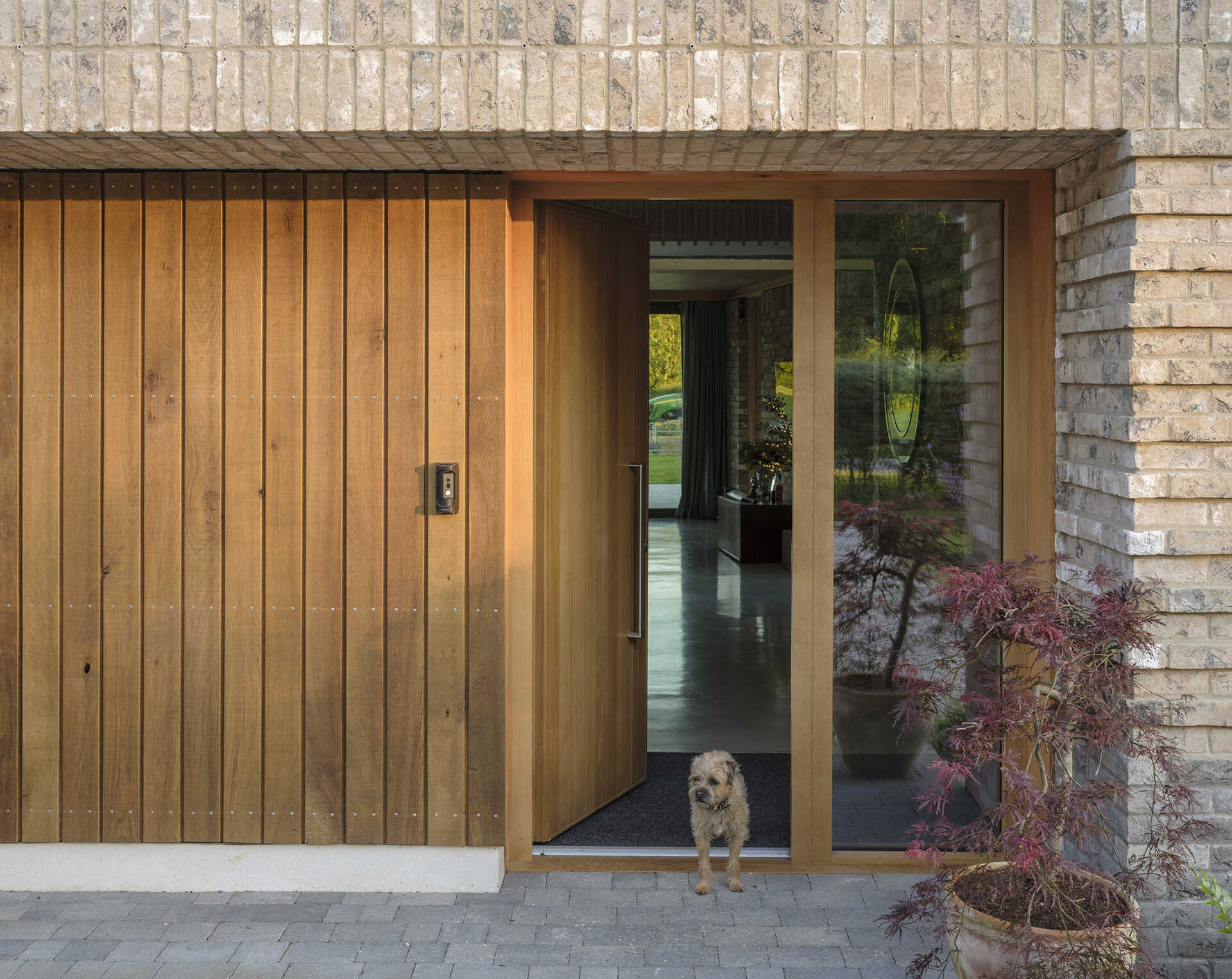 Explore the textured brickwork of this modern Suffolk house, where different brick patterns reference the history of traditional English longhouses.