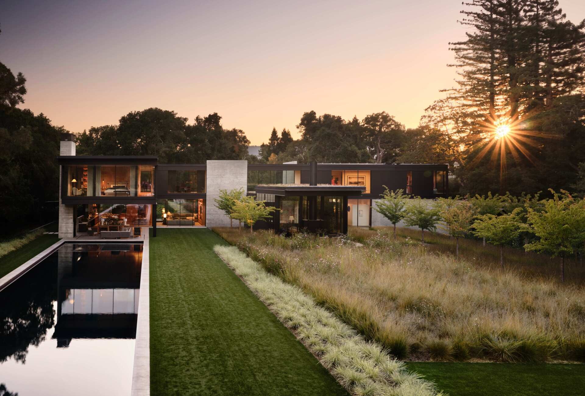 Discover the landscape design of this modern Bay Area home by Andrea Cochran Landscape Architecture. Featuring ornamental grasses, tree-lined gravel pathways, woodland gardens, native planting, and sustainable landscaping ideas across a 3.5-acre California property.