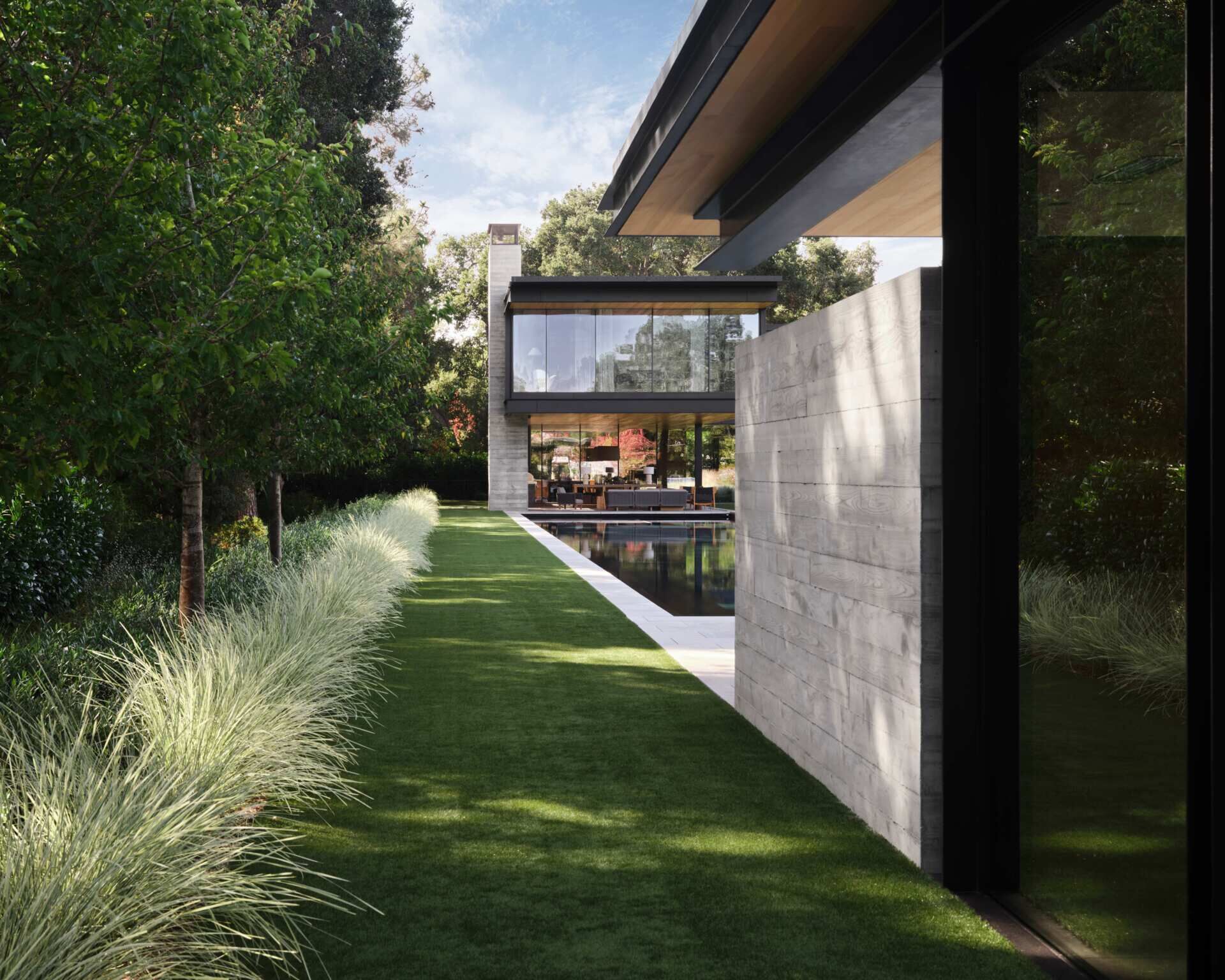 Discover the landscape design of this modern Bay Area home by Andrea Cochran Landscape Architecture. Featuring ornamental grasses, tree-lined gravel pathways, woodland gardens, native planting, and sustainable landscaping ideas across a 3.5-acre California property.