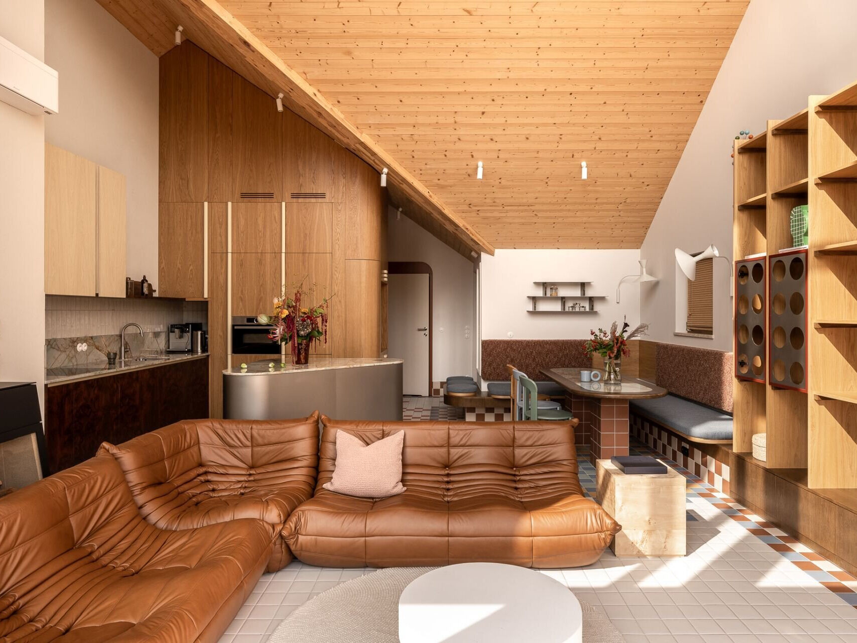 Explore Kalbornia Lake & Pool House in Poland, a contemporary lakeside home featuring colorful interiors by ASID Studio, custom mosaic tiles, designer furniture, and beautiful lake views.