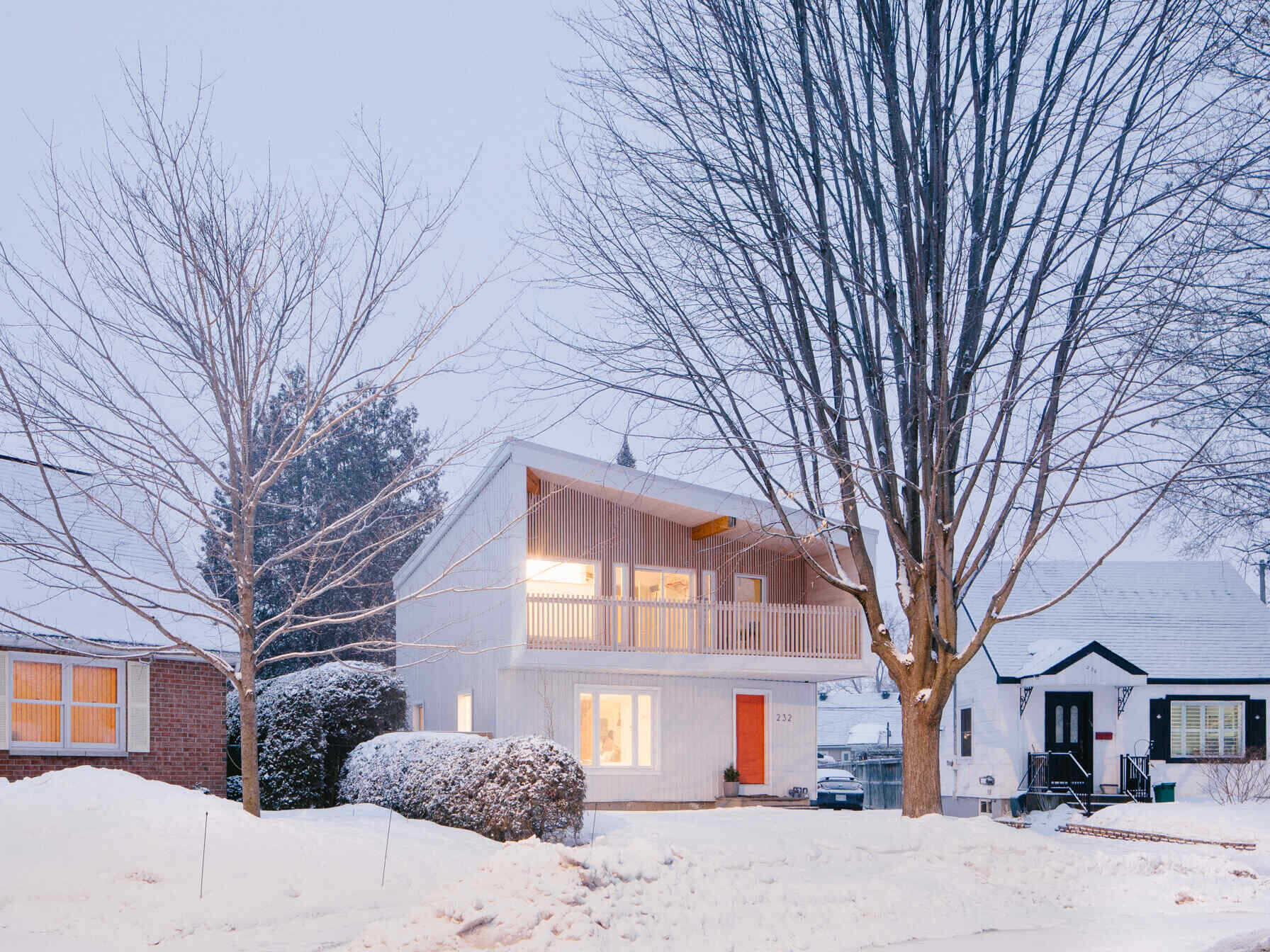 Discover how 25:8 Architecture + Urban Design transformed a small post-war house in Ottawa, Canada, into a bright, contemporary two-story family home with a budget-conscious design.