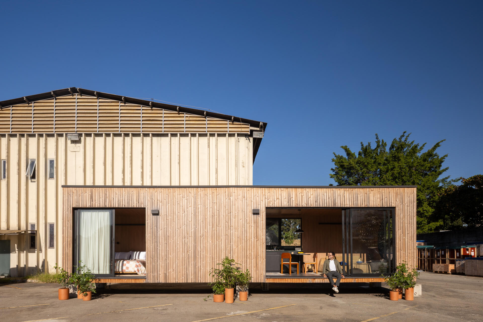 A 409 square foot prefabricated house by Muda Prefab in São Paulo, Brazil, designed around factory manufacturing, transportation, and efficient assembly.