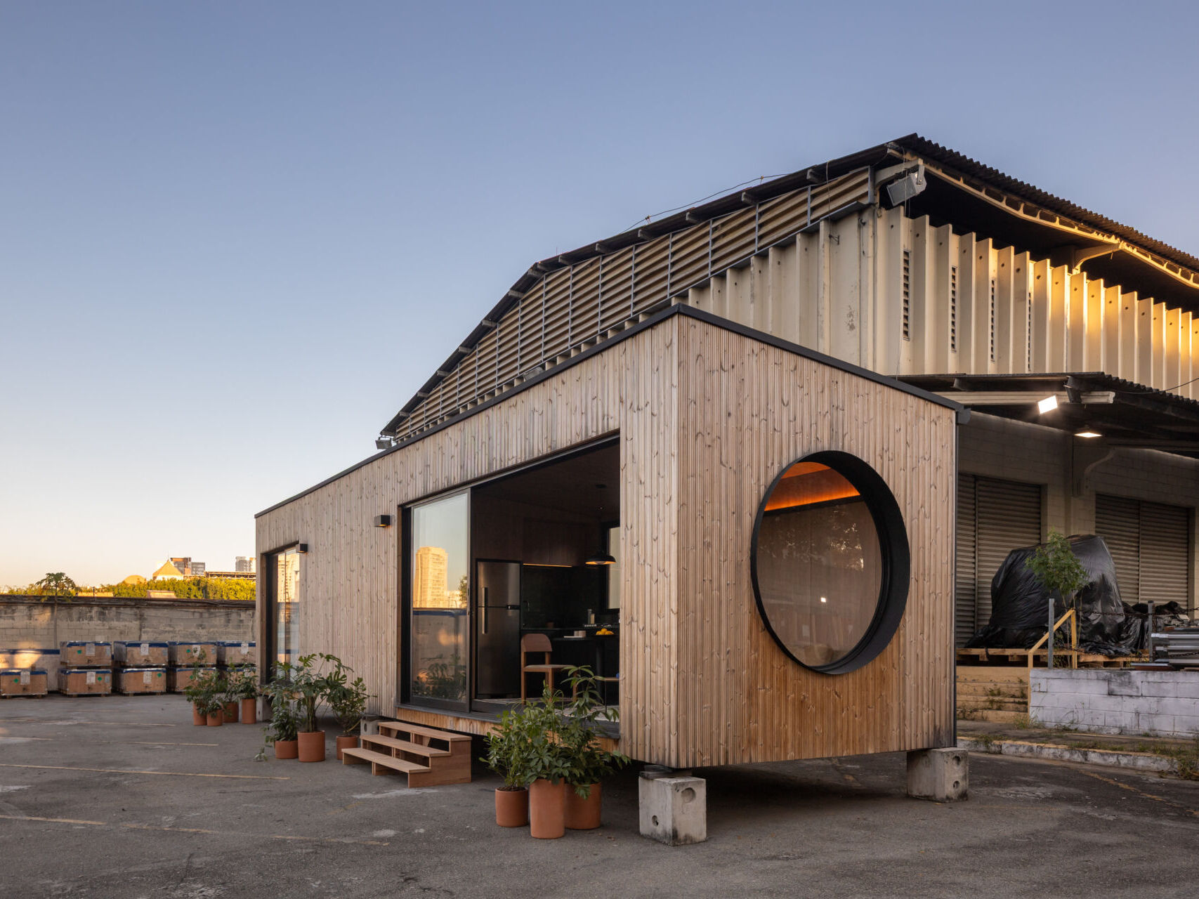 A 409 square foot prefabricated house by Muda Prefab in São Paulo, Brazil, designed around factory manufacturing, transportation, and efficient assembly.